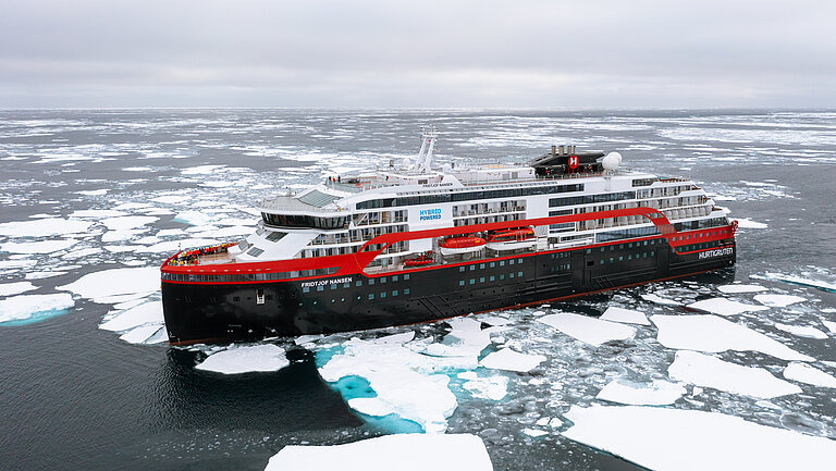 A ship between ice floes