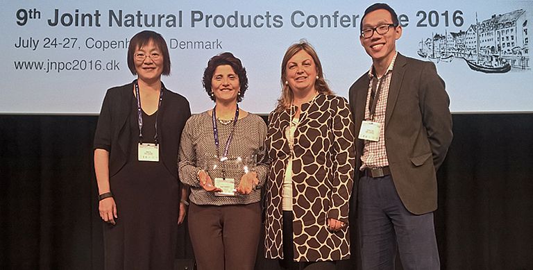 Prof. Deniz Tasdemir (with the trophy of the award) together with the representatives of the Waters Corp. Dr. Jimmy Yuk, Kate Yu, and the president of the GA, Prof. Dr. Anna Rita Bilia. Photo: Toni Kotnik