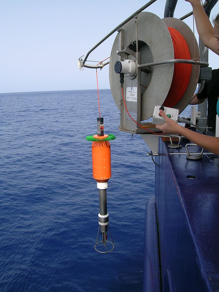 Microstructure probe at the stern of the Meteor when launching with the instrument's own winch. The fast fading of the orange Kevlar cable allows the turbulence measurements to be carried out almost in free fall of the probe through the water. Photo: Marcus Dengler.