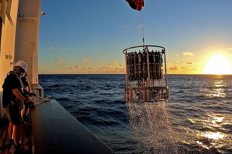 A rosette water sampler with water samples is brought back on board the German research vessel SONNE on expedition SO289 in the South Pacific.