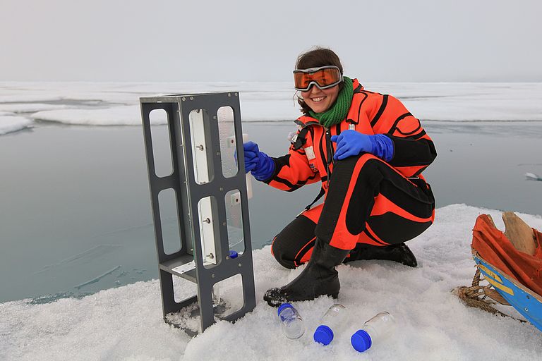 Luisa Galgani with sampling gear in front of a melt pond. Photo: Karl Attard