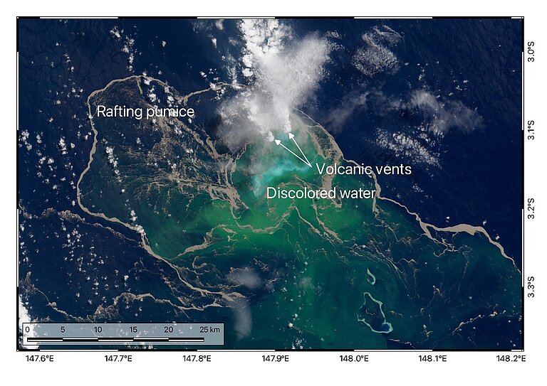Satellite image of the sea surface; the water is dark blue but has a green tinge in places, and a white cloud of vapour is rising from the water