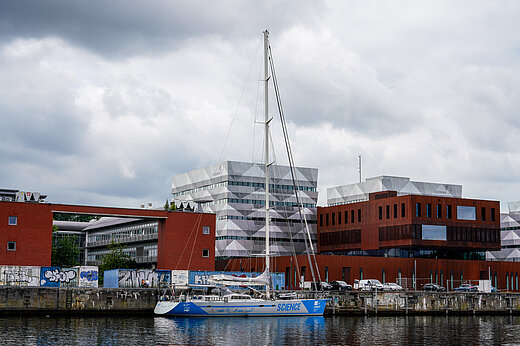 The research sailing vessel Malizia Explorer in front of the GEOMAR building