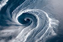 A massive cyclone swirls across the sea