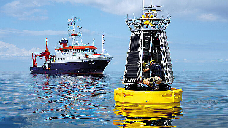 A buoy and a ship on the water