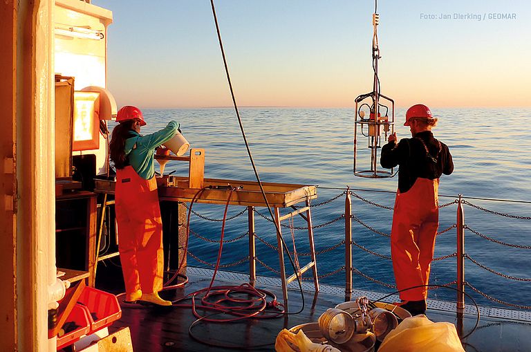 Two scientist taking samples from RV Alkor  in the Baltic Sea