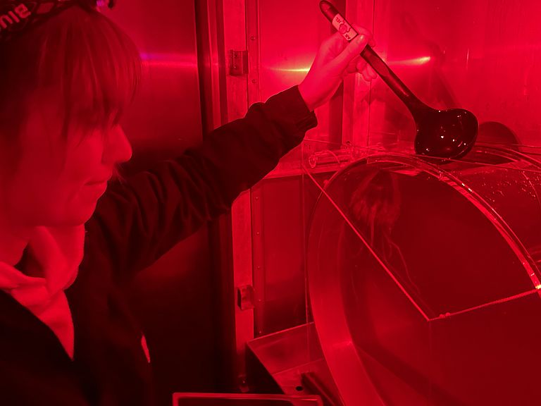 Vanessa Stenvers has just started her PhD at GEOMAR and is investigating the influence of sediment input on Periphylla. The deep-sea jellyfish are extremely sensitive to light, hence the red light headlamp in the  dark climate chamber. Photo: Helena Hauss