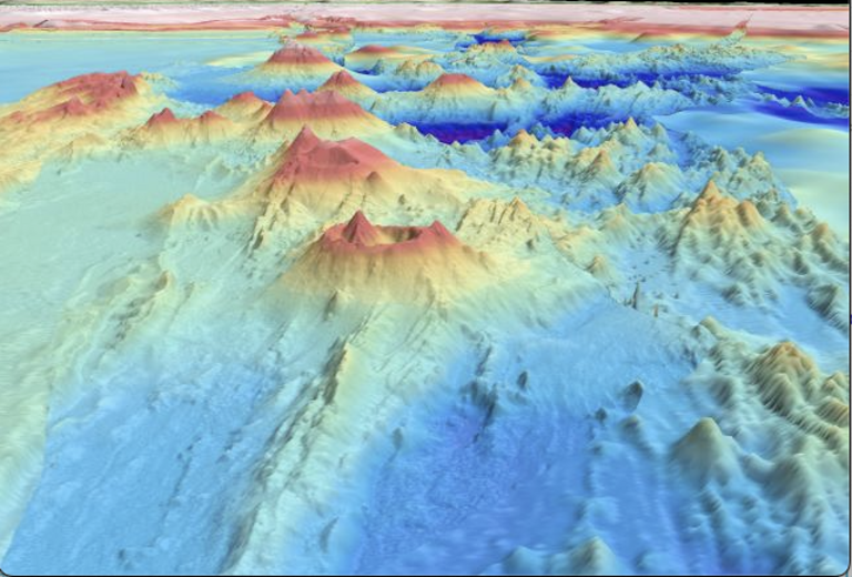 A three-dimensional map of mountains rising out of the sea