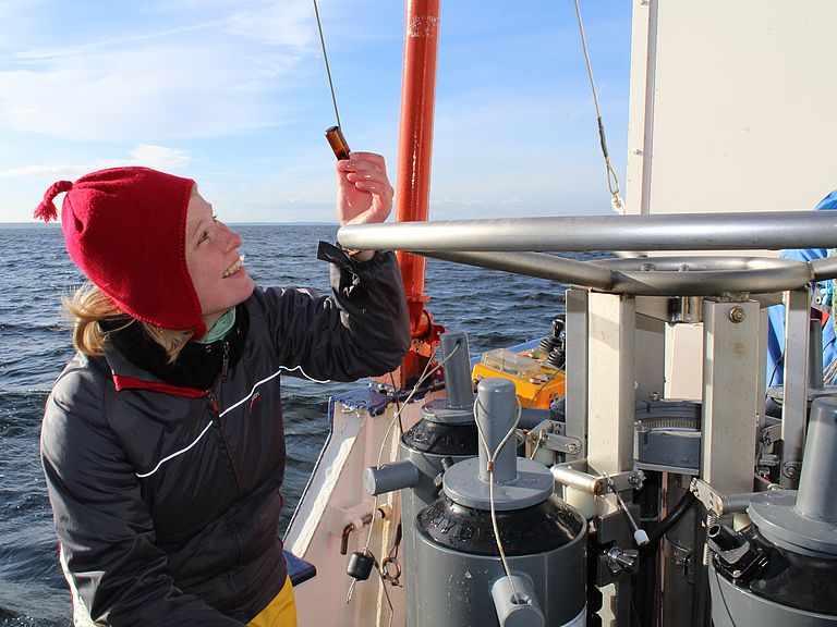 Examination of a water sample during an excursion with the research cutter LITTORINA