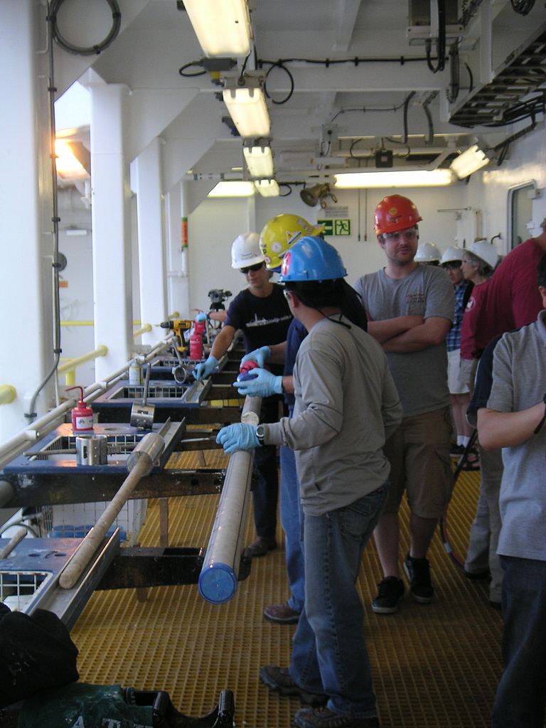 Dr Ed Hathorne (red hard hat) during IODP expedition 321 onboard  JOIDES RESOLUTION. Photo: private