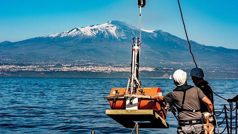 Installation of geodesy stations on the southeast flank of Etna. 