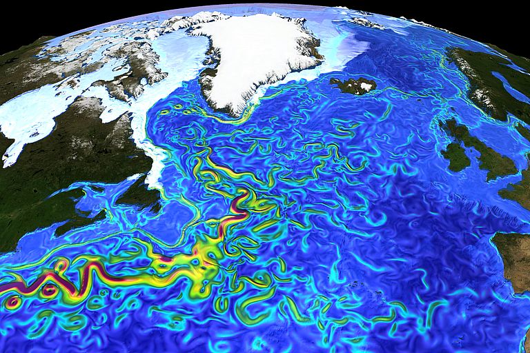 Momentaufnahme der Strömungsgeschwindigkeiten und Meereisverteilung im hochaufgelösten Ozeanmodell. Das Bild illustriert den verwirbelten Verlauf des Golfstroms sowie die schmalen Strombänder und Wirbel in den Meeresgebieten um Grönland. Grafik: Ozeanmodellierungsgruppe GEOMAR