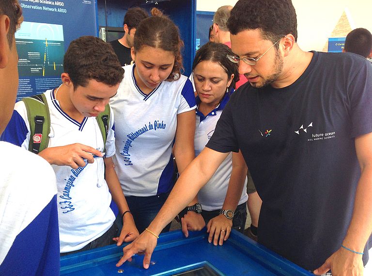 A Brazilian guide explains one of the many exhibits to a group of high school students. Photo: Friederike Balzereit, Future Ocean