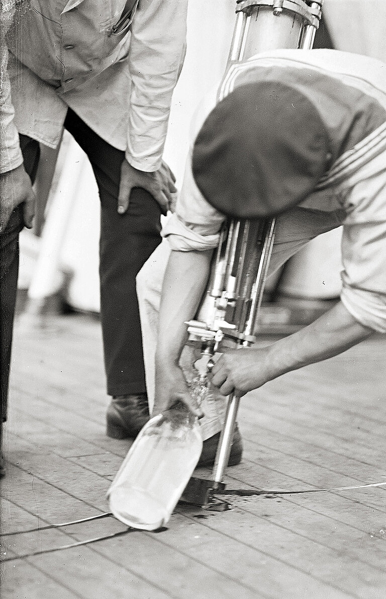 Water being drawn from the four-litre water sampler. 